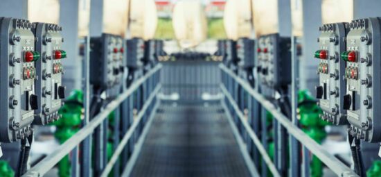 Electronic control systems lining both sides of a walkway