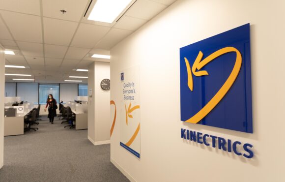 Kinectrics logo on the wall of an office