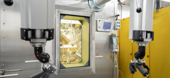 Remote manipulators in front of a "warm cell"