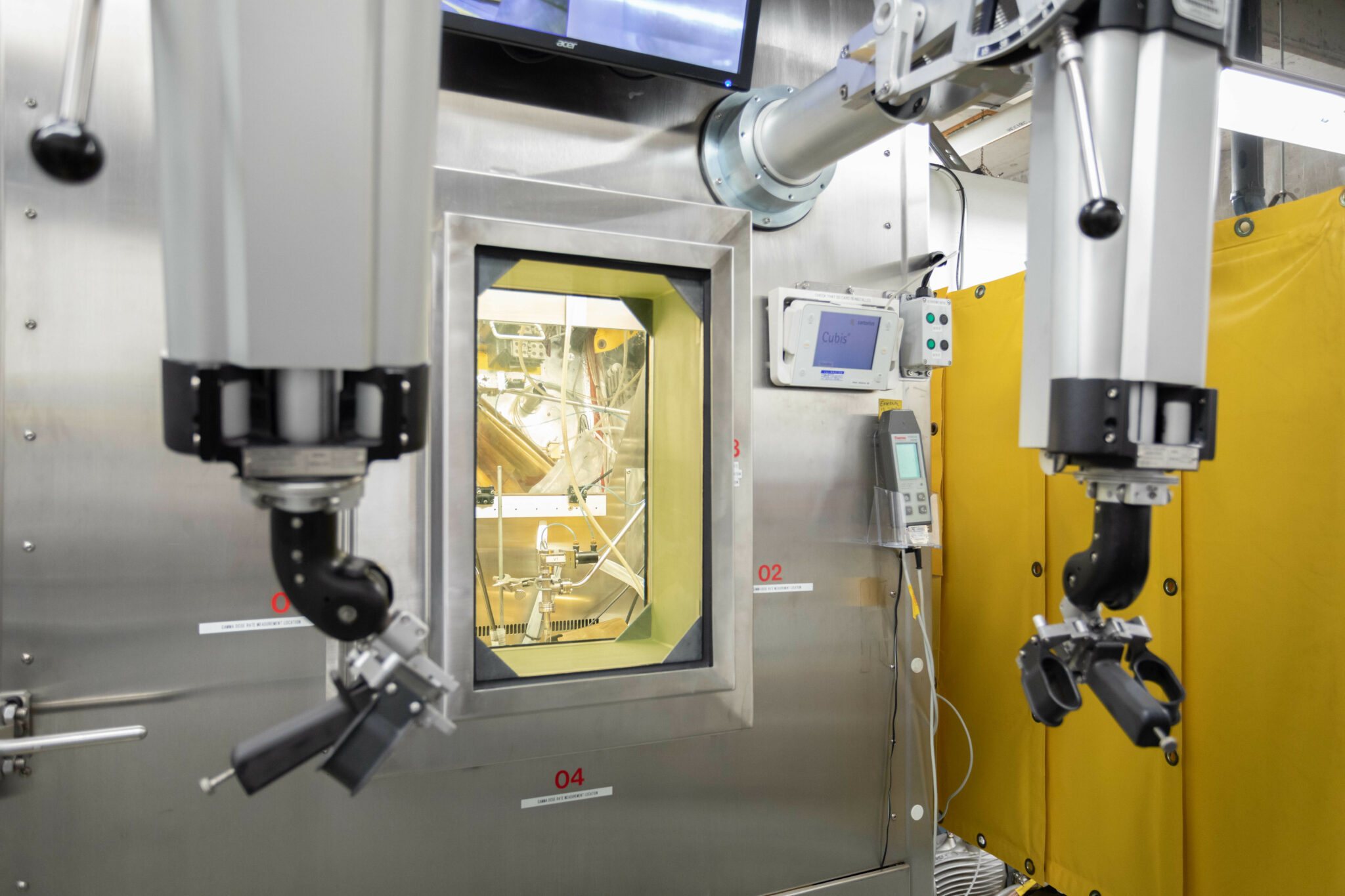 Remote manipulators in front of a "warm cell"