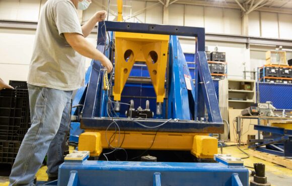 A worker preparing the random input motion table for testing