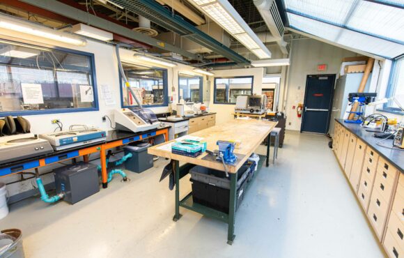 Workshop interior with large work benches and equipment stations