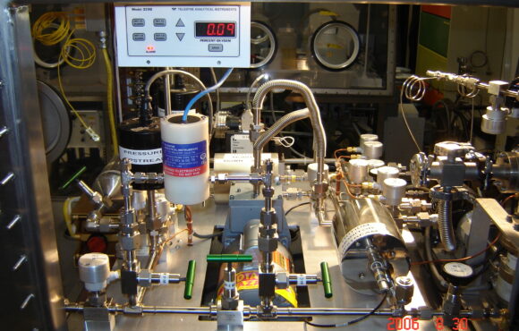 Closeup photograph of various nuclear components within an analysis machine