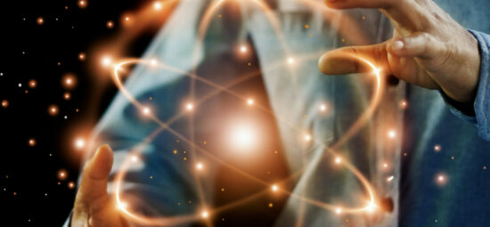 Abstract art of a worker holding an sparkling atomic symbol