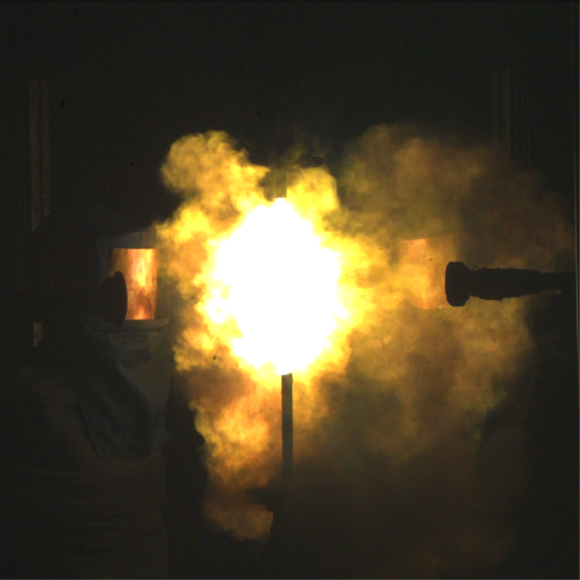 Dummy wearing a shielded helmet undergoing arc hazard test