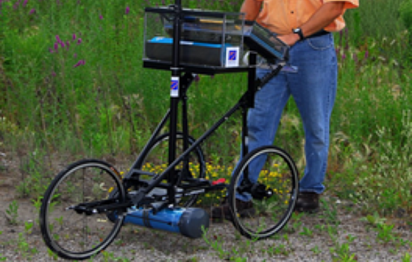 Photograph of worker surveying an outdoor location